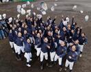 選抜高校野球大会への初出場が決まり、帽子を投げて喜ぶ大崎の選手たち＝２９日午後、長崎県西海市